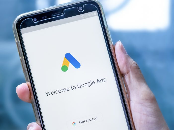 PPC Agency reviewing google ads on phone screen