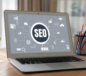 laptop on seo agency desk showcasing improvements