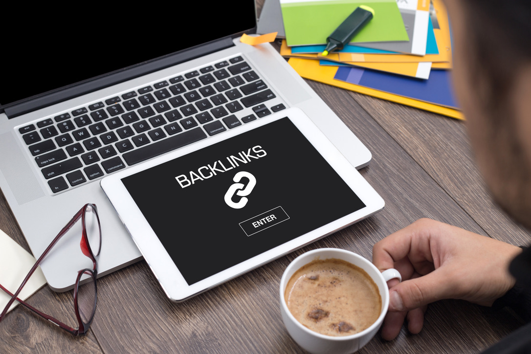 SEO Agency working on website backlinks on laptop