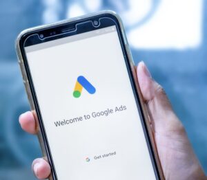 PPC Agency reviewing google ads on phone screen