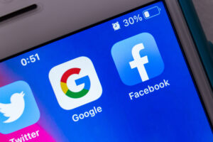 Google and Facebook app icons showing on mobile device